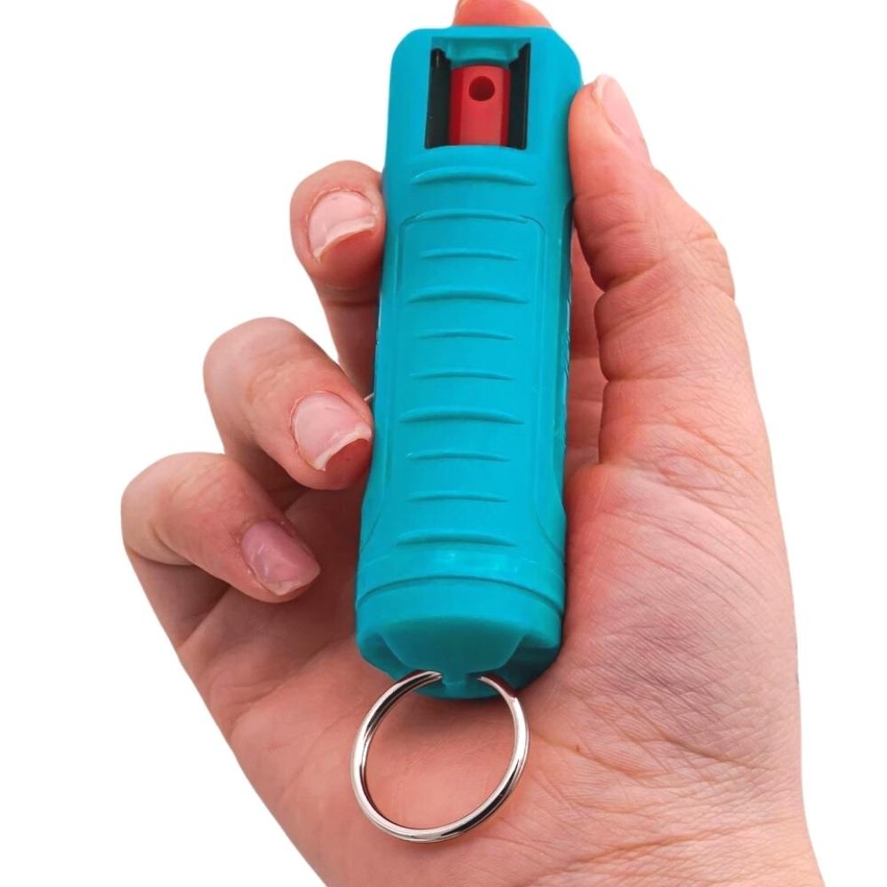 powerful pepper spray keychain included in turquoise trouble self-defense kit